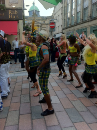 dancers in new Brazilian National Tartan by Clan Italia having a good time at festival in Glasgow